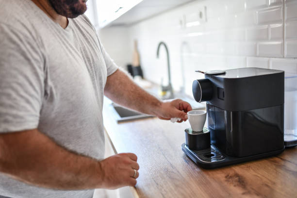 istock Male Making Coffee On Espresso Machine At Home 1342109745