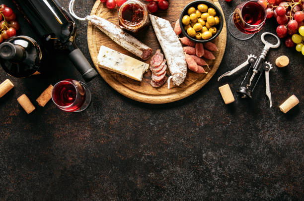 Wine tasting background with copy space for a text Wine tasting background with a charcuterie board, top-down view composition with copy space for a text charcuterie stock pictures, royalty-free photos & images