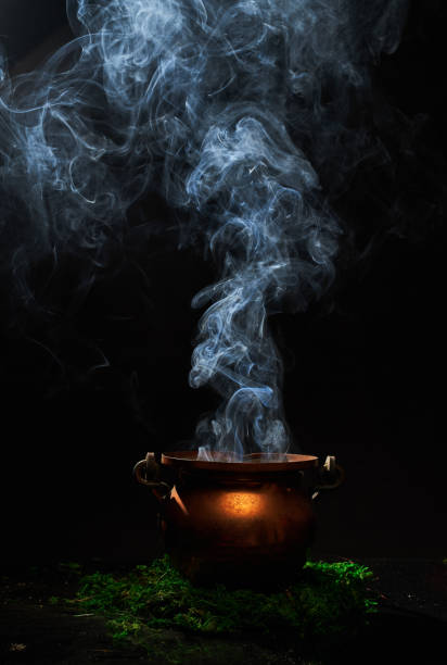istock The witch's smoking cauldron on dark background. 1342109845