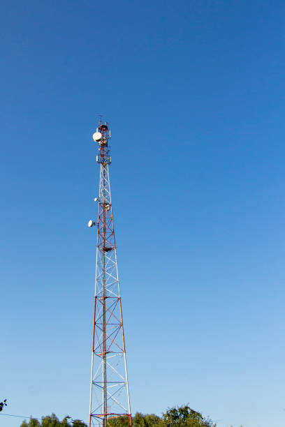istock Telecommunications tower and satellite dish telecom network on blue sky 1342115161