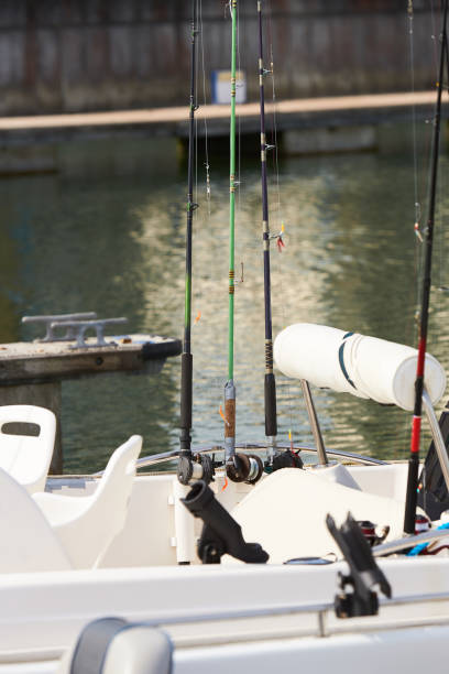 istock Fishing rods with reels on the boat in natural setting 1342116534