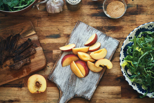istock Preparing Steak with Arugula Peach Salad 1342116728