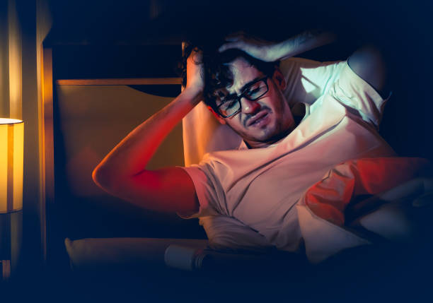 istock tired caucasian male having stressed problem with sleeping pill medication for insomnia treatment. 1342117654