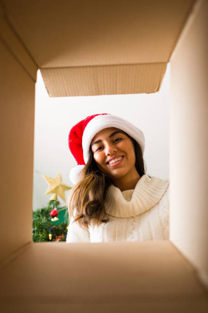 istock Attractive woman with a santa hat 1342117833