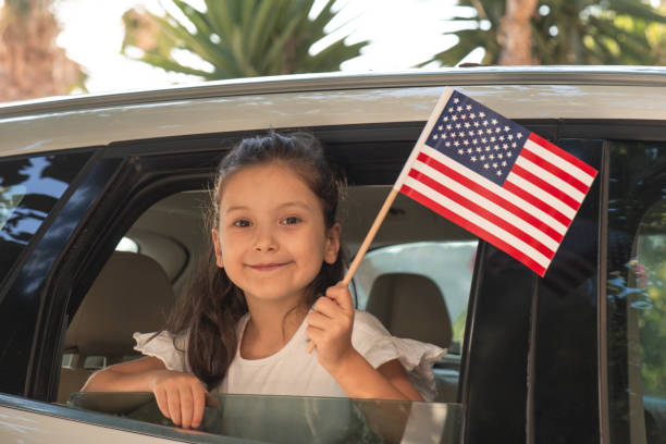 istock Girl Holding American Flag 1342117937