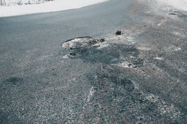 istock Pit and pothole in the asphalt on the road 1342119028