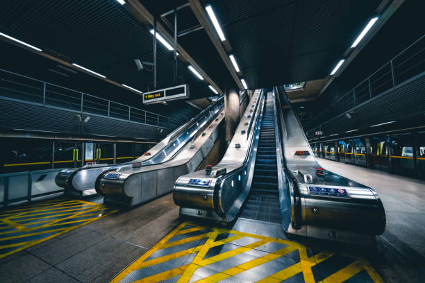 istock Commuters on escalator at subway station Canary Wharf 1342119295