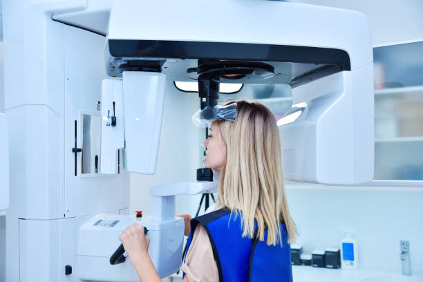 istock Woman patient make a dental computer tomograph. 1342121405