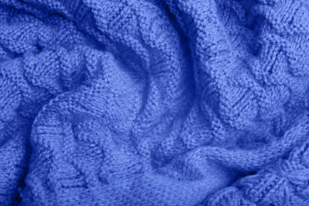 istock Close up of blue knitted textured background. 1342124590