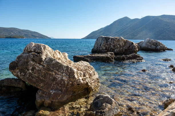 istock Big rock in water on Lefkada island beach, Greece 1342124804