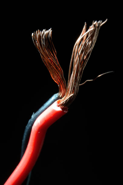 istock bare copper wires in black and red on a dark background. macro. 1342127575