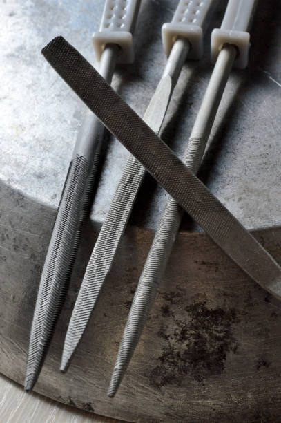 istock several metal files are on the metal surface. close-up. 1342127659