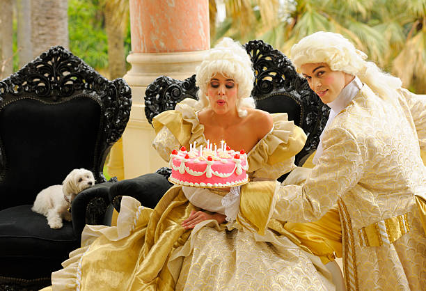 Happy Aristocratic Birthday with Cake Marie Antoinette blowing out the candles on her birthday cake cake models stock pictures, royalty-free photos & images