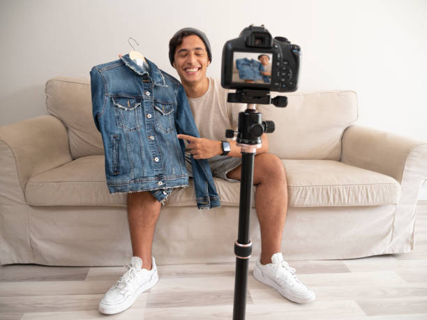 istock Hispanic young man creating clothing content for social networks 1342133332