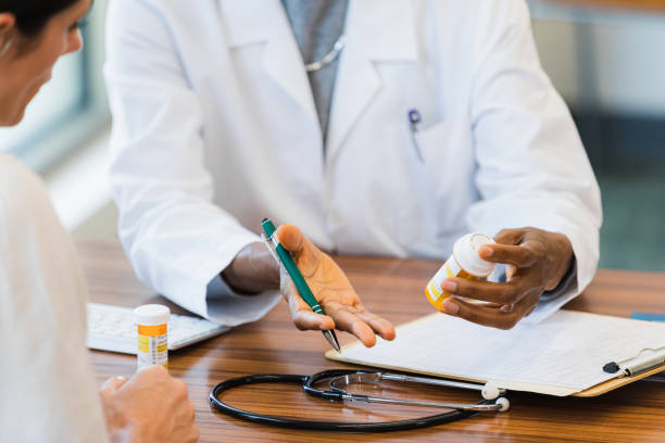 istock Female doctor discusses medication with patient 1342134422