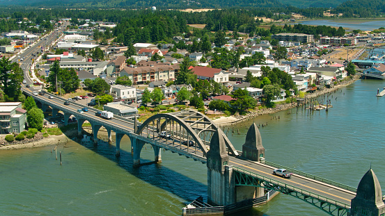 Drone shot of Florence, a small city on the banks of the Siuslaw River in Lane County, Oregon on a sunny day in summer.
