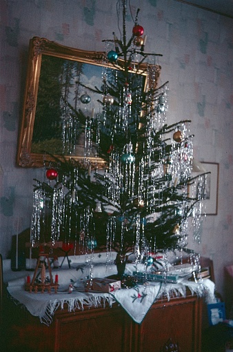 Germany, 1969. Christmas tree on a chest of drawers.