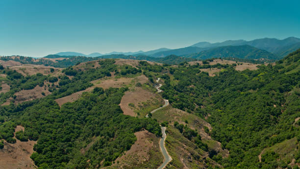 Aerial shot of winding road in the Santa Lucia Range above the Carmel Valley near Monterey, California on a sunny day in summer.