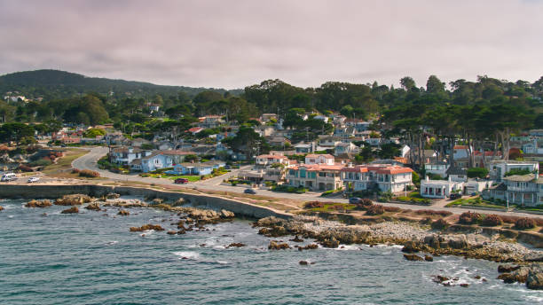 Coastal Houses in Pacific Grove, CA Aerial shot of Pacific Grove, a small city in Monterey County, California. 

Shot by FAA licensed drone pilot with permit from the City of Pacific Grove. city of monterey california stock pictures, royalty-free photos & images