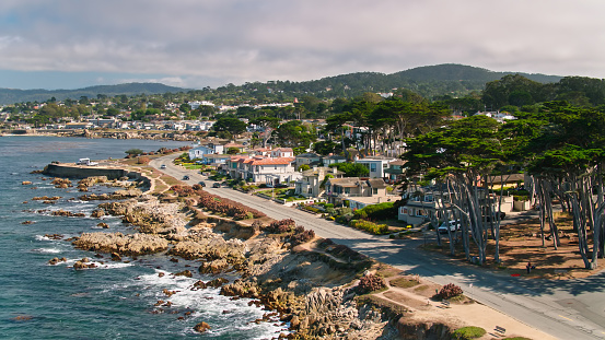Monterey, CA, USA – December 16, 2022: Fish Hopper Restaurant on a pier and view of Monterey Bay in Monterey, California.