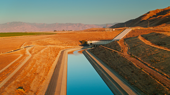 Aerial shot of a pumping plant for the California Aqueduct near Mettler in Kern County, California at sunset.