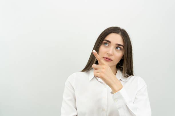 istock woman pointing finger up 1342143108