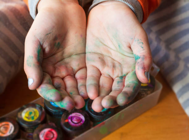 istock kids hands stained with watercolor 1342143255