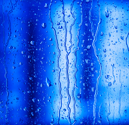 Water drops on glass, close-up.