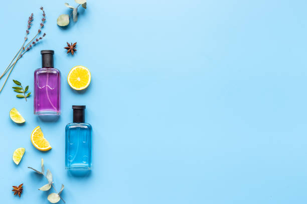 istock Perfume bottles with leaves and fruits, top view 1342144464