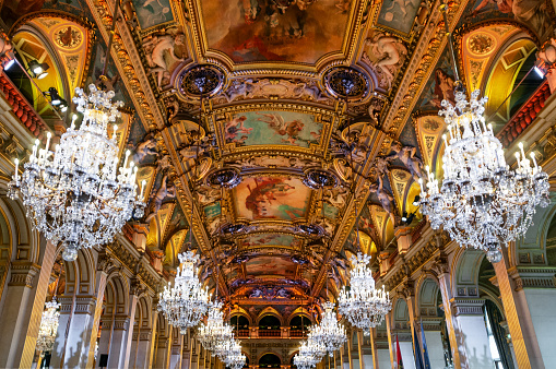 Paris cityhall indoor ( mairie de Paris ) : ceiling and pending light in reception room / banquet room. Paris, in France. September 18, 2021