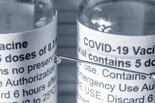 Covid-19 vaccination vials & syringe.