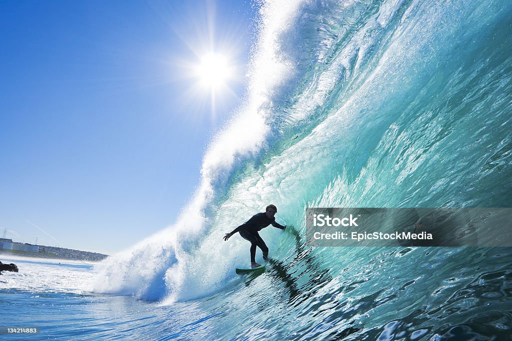 Surfing Surfer on perfect wave in the barrelSurfer on perfect wave in the barrel Surfing Stock Photo