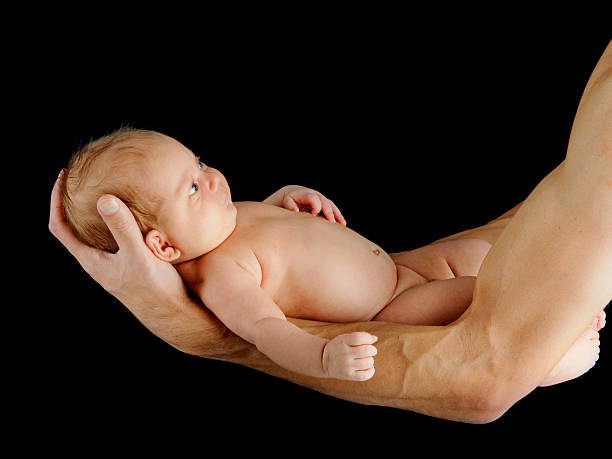 istock Father holding newborn baby 134214905