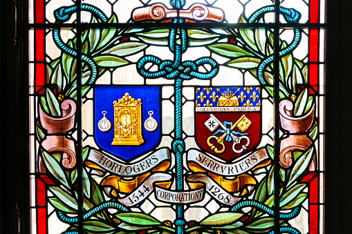 Paris cityhall indoor ( mairie de Paris ) : detail on a window with the coats of corporations arms. Paris in France, Place de l'Hotel de Ville. September 18, 2021.