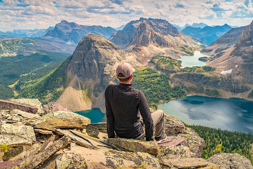 Hiker enjoys view from Pharaoh Peaks, Egypt Lake in Banff National Park, Alberta, Canada.