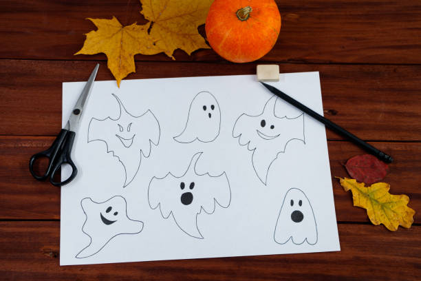 istock Halloween DIY. Step by step instructions on how to draw funny ghosts. 1342154608