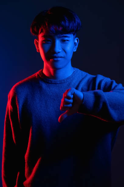 istock thumb down gesture dislike sign neon light man 1342155707