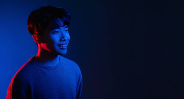 istock neon light man cyberpunk banner asian guy blue 1342155713