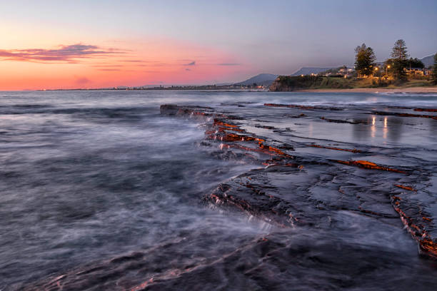 istock Sunrise Over the Ocean At Sunrise with Rocks and Reflection 1342163042