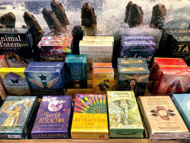 A row of tarot cards and astrology products for sale on a shelf in Tlell, Haida Gwaii, Canada. stock photo