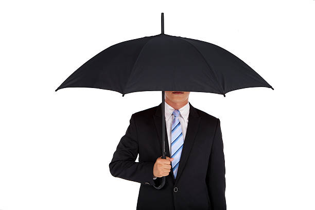 istock businessman holding black umbrella 134216334