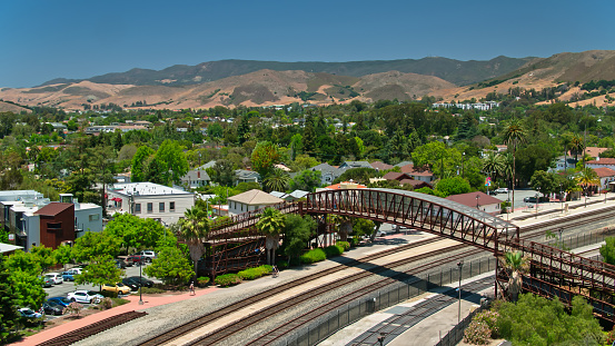Aerial shot of the passenger train station and Historic Railroad District in San Luis Obispo, California on a sunny afternoon in summer. \n\nAirspace authorization was obtained from the FAA for this operation.