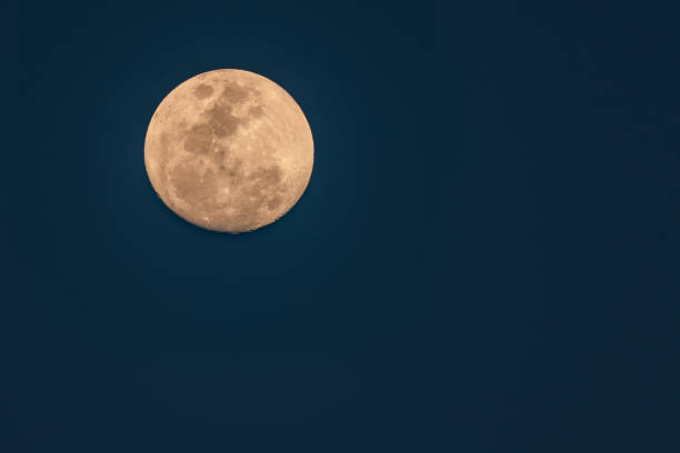 istock Ninety Eight Percent Full Moon in an early evening sky 1342165910