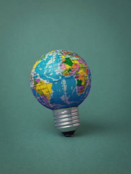 istock A globe lamp on a dark green background. 1342174280