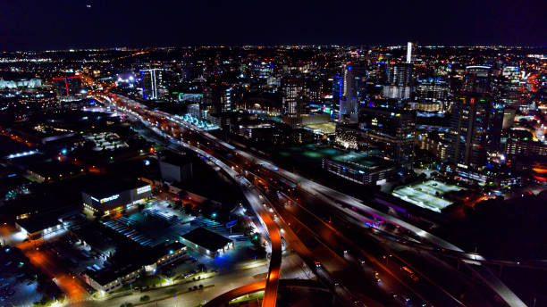 istock Freeway Traffic in Dallas at Night - Aerial 1342175544