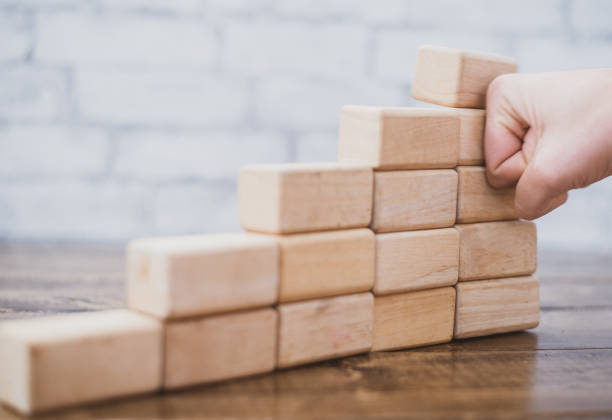 istock Hand Smashing Down a Tower of Blocks 1342177465