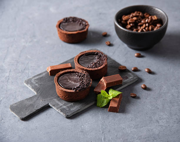 istock mini chocolate tarts with coffee beans on a gray background 1342178436