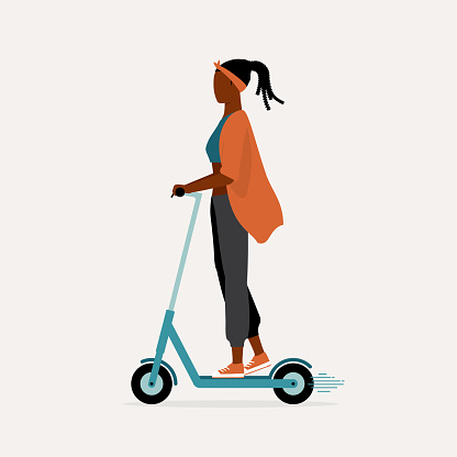 Young Black Woman Riding An Electric Scooter. Eco-Friendly Transportation. E-Scooter. Micromobility.