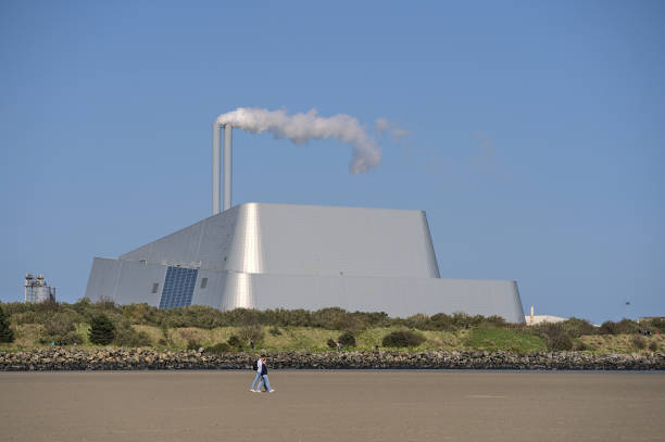 Covanta Plant (Dublin Waste to Energy) against clear blue sky seen from Sandymount Beach stock photo
