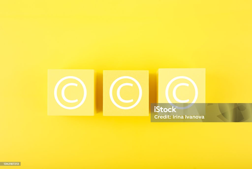 Copyright and intellectual property protection concept on yellow background Minimal trendy copyright, intellectual property and patenting concept. Copyright symbol on yellow cubes against bright yellow background Driver's License Stock Photo